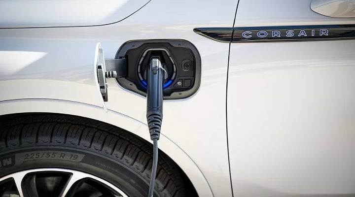 An electric charger is shown plugged into the charging port of a Lincoln Corsair® Grand Touring
model. | Koons Lincoln of Bethesda in Silver Spring MD